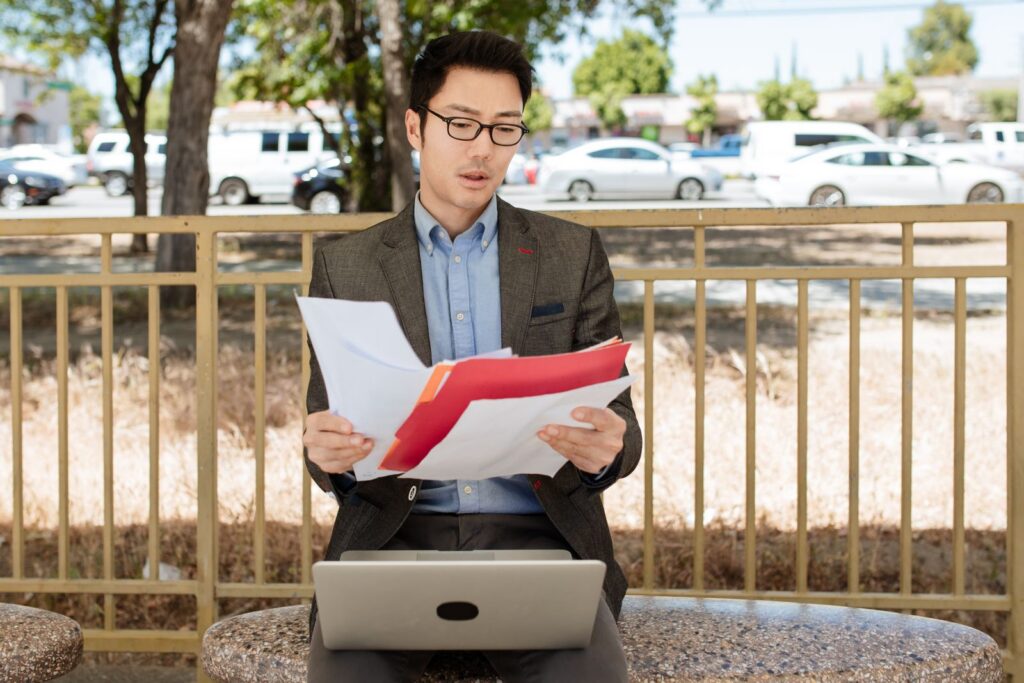 Professional reviewing documents at a desk